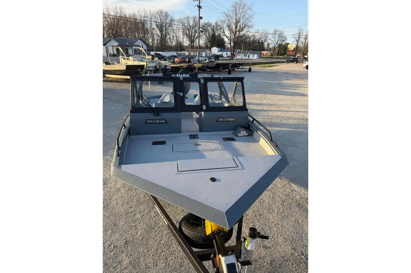 Slide: The Image of 2026 SeaArk ProCat 200 boat on trailer, parked outdoors in a lot. - 10