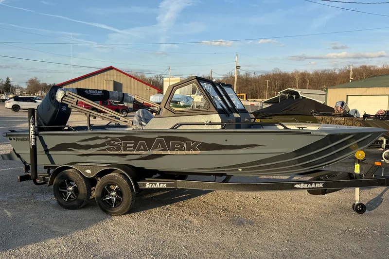 Slide: The Image of 2026 SeaArk ProCat 200 boat on trailer, parked outdoors under clear sky. - 6