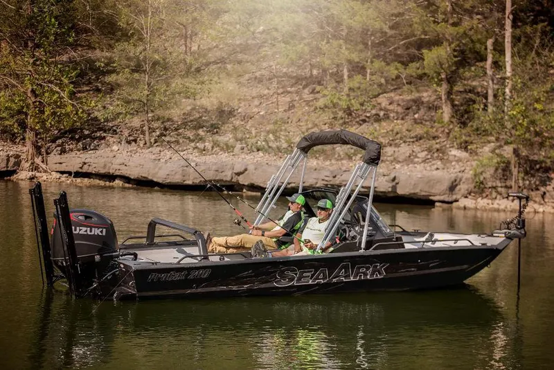 Slide: The Image of 2026 SeaArk ProCat 200 boat interior with dual seats, steering console, and spacious deck. - 7