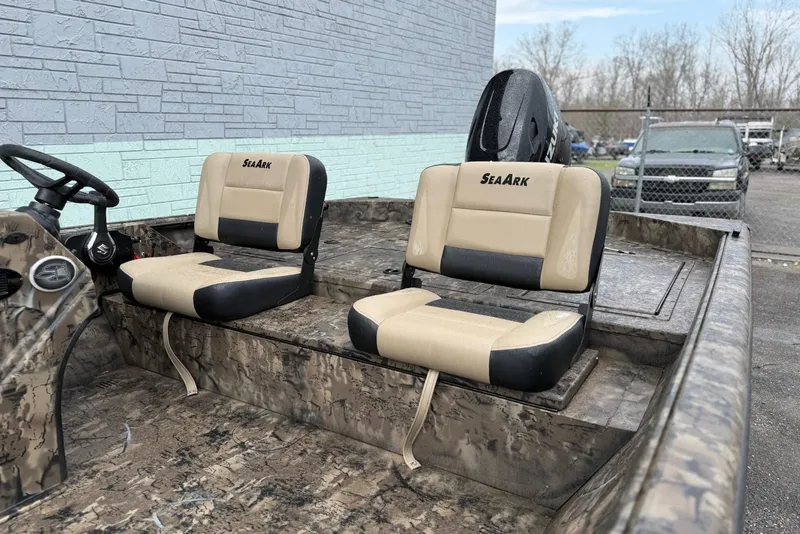 Slide: The Image of 2026 SeaArk Phantom 20XV boat with camouflage design and dual beige seats. - 7