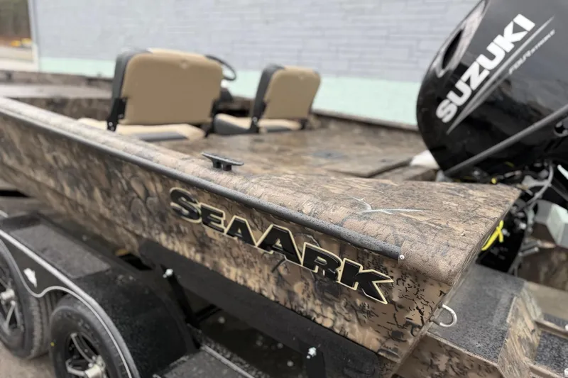 Slide: The Image of 2026 SeaArk Phantom 20XV boat with Suzuki engine, featuring camouflage design and dual seats. - 9