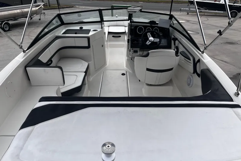 Slide: The Image of 2018 Sea Ray SPX 190 Outboard boat interior with seating and steering console. - 10