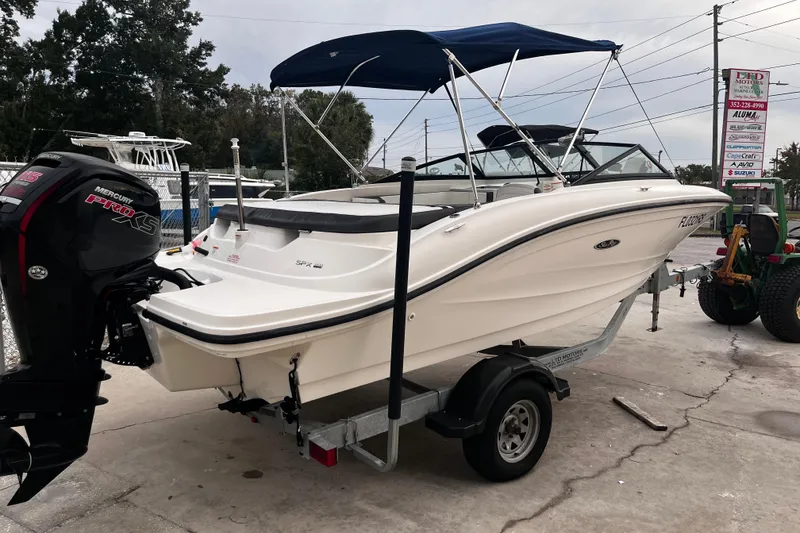 Slide: The Image of 2018 Sea Ray SPX 190 Outboard boat with Mercury engine on trailer. - 11