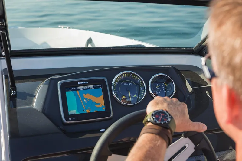 Slide: The Image of Manufacturer Provided Image: 2018 Sea Ray SPX 190 OB dashboard with navigation system and gauges. - 3