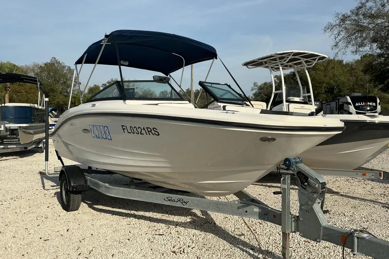 Slide: The Image of 2018 Sea Ray SPX 190 Outboard boat on trailer, parked outdoors. - 8