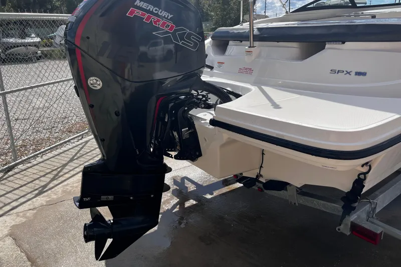 Slide: The Image of 2018 Sea Ray SPX 190 Outboard with Mercury Pro XS engine, parked on a trailer. - 9