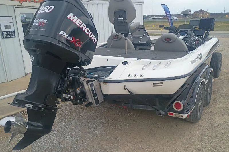 Slide: The Image of 2010 Ranger Z521 boat with Mercury Pro XS engine, parked near sales and service building. - 6