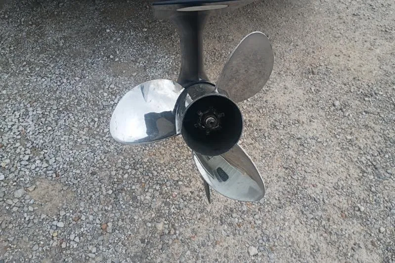 Slide: The Image of 2010 Ranger Z521 boat propeller on gravel surface. - 7