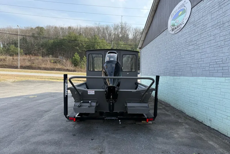 Slide: The Image of 2026 SeaArk 2472 CUB boat parked outside Water Work Marine building. - 5