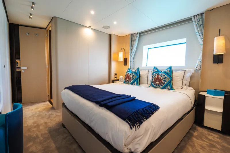 Slide: The Image of Luxurious bedroom interior on 2023 Azimut Grande 32M yacht, featuring elegant decor and modern amenities. - 11