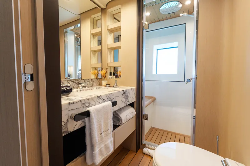 Slide: The Image of Luxurious bathroom on 2023 Azimut Grande 32M yacht with marble sink and modern shower. - 12