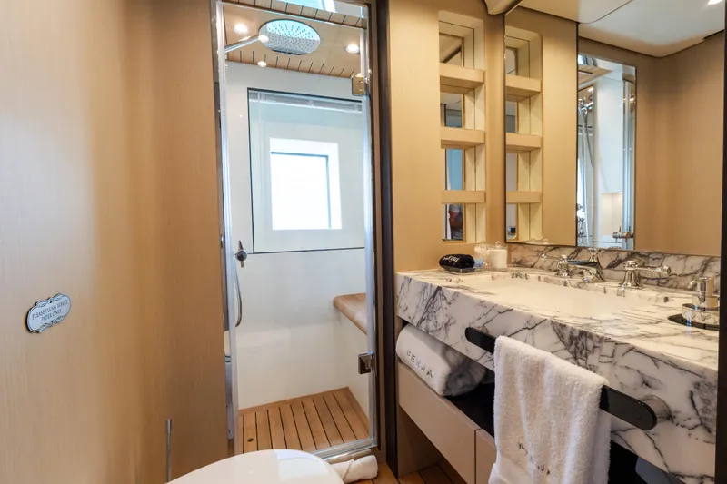 Slide: The Image of Luxurious bathroom in 2023 Azimut Grande 32M yacht with marble sink and modern shower. - 15