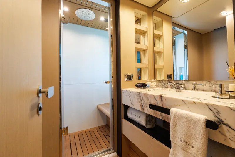 Slide: The Image of Luxurious bathroom in 2023 Azimut Grande 32M yacht with marble sink and modern shower. - 18
