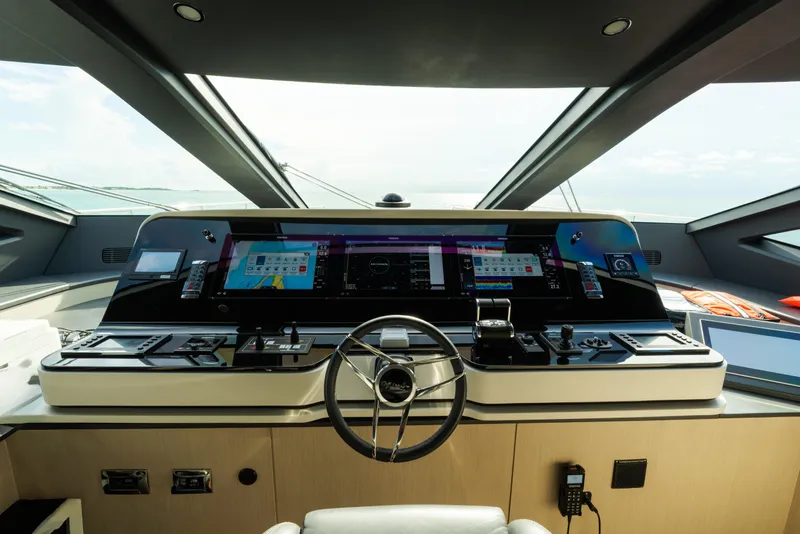 Slide: The Image of Helm of 2023 Azimut Grande 32M yacht with advanced navigation controls and displays. - 20