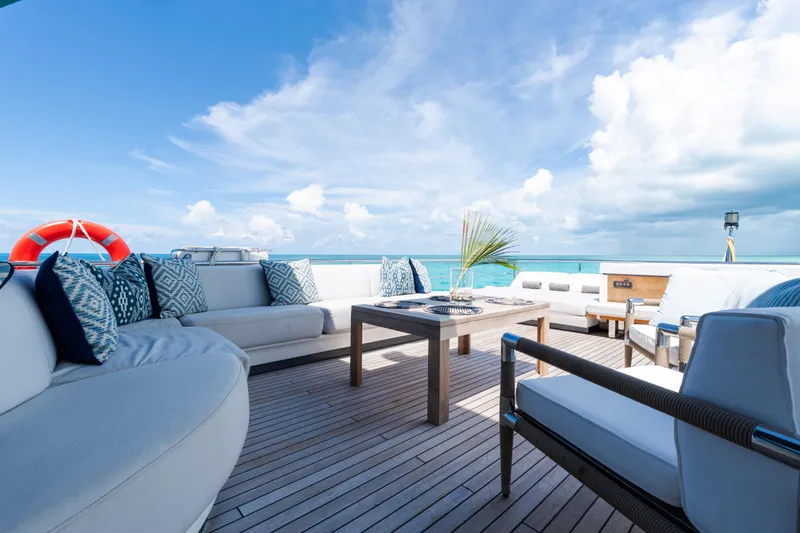Slide: The Image of Luxurious deck of 2023 Azimut Grande 32M yacht with elegant seating and ocean view. - 25