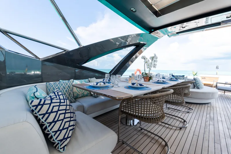 Slide: The Image of Luxurious dining area on 2023 Azimut Grande 32M yacht with elegant table setting. - 28