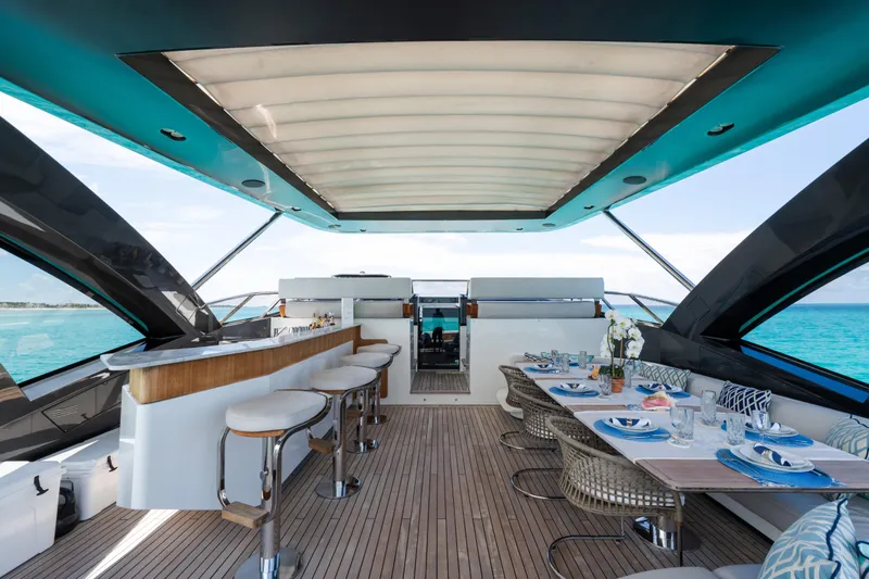 Slide: The Image of Luxurious 2023 Azimut Grande 32M yacht deck with elegant dining and bar area. - 30