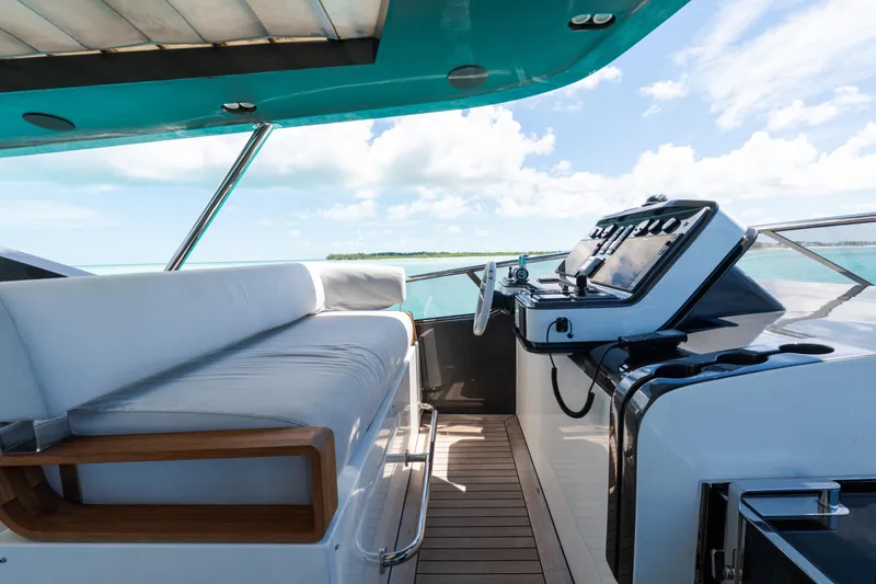 Slide: The Image of Luxurious 2023 Azimut Grande 32M yacht helm with plush seating and ocean view. - 32