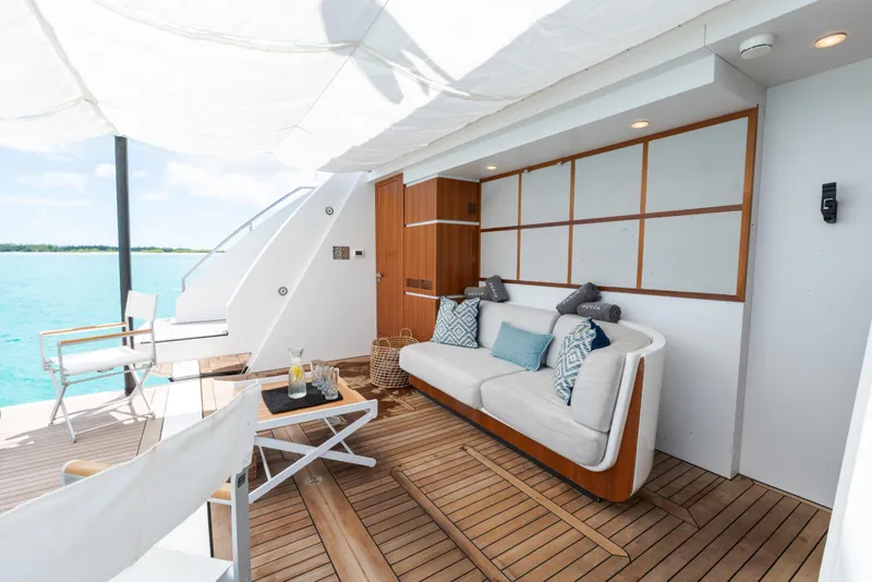 Slide: The Image of Luxurious deck of 2023 Azimut Grande 32M yacht with elegant seating and ocean view. - 38