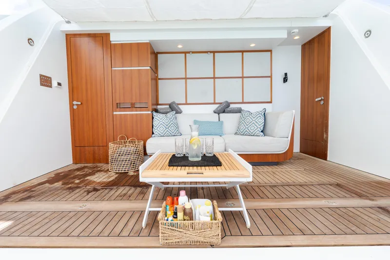 Slide: The Image of Luxurious Azimut Grande 32M yacht interior with elegant seating and wooden accents, 2023 model. - 39