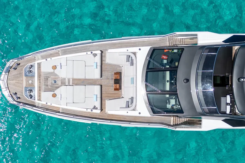 Slide: The Image of Aerial view of 2023 Azimut Grande 32M yacht on turquoise water. - 40