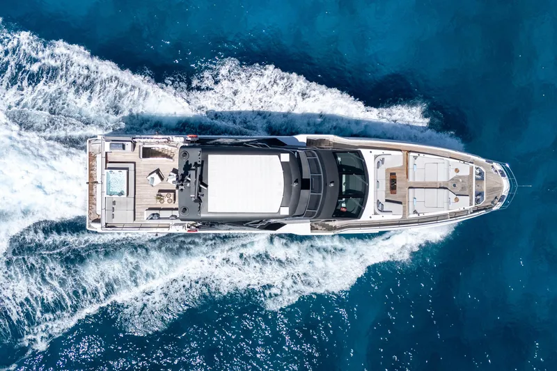 Slide: The Image of Aerial view of 2023 Azimut Grande 32M yacht cruising on blue ocean waters. - 43