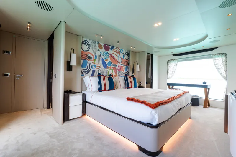 Slide: The Image of Luxurious bedroom interior of 2023 Azimut Grande 32M yacht with modern decor and large window. - 8