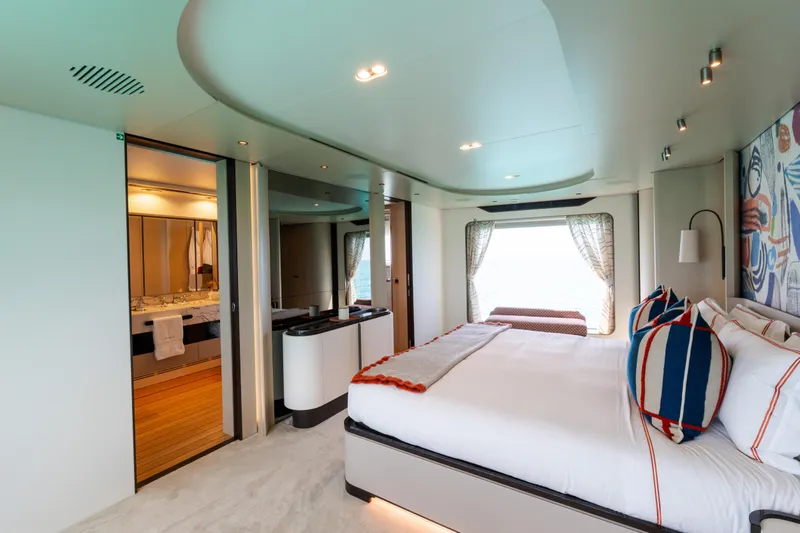 Slide: The Image of Luxurious bedroom interior of 2023 Azimut Grande 32M yacht with modern decor and ocean view. - 9