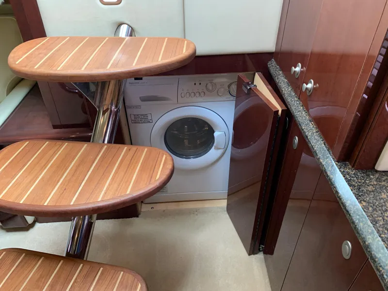 Slide: The Image of Washing machine under stairs in 2007 Sea Ray 52 Sundancer yacht. - 13