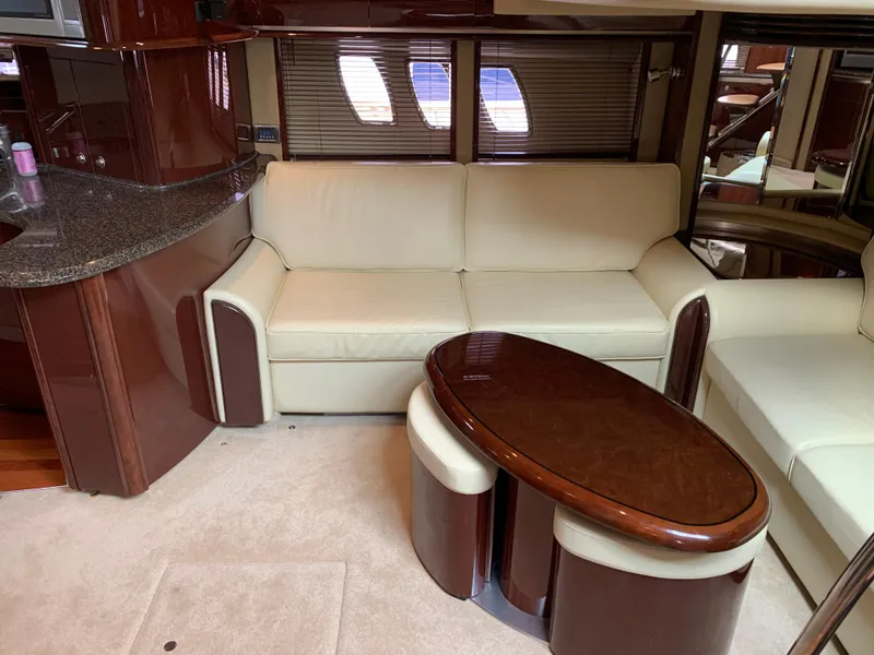 Slide: The Image of Interior of 2007 Sea Ray 52 Sundancer with leather sofa and wooden table. - 17
