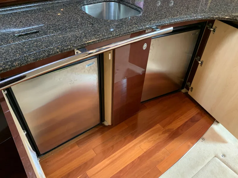 Slide: The Image of 2007 Sea Ray 52 Sundancer kitchen area with wood flooring. - 21