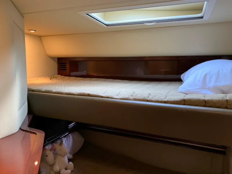 Slide: The Image of 2007 Sea Ray 52 Sundancer cabin interior with bed. - 23