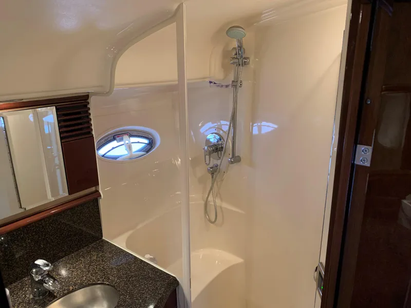 Slide: The Image of 2007 Sea Ray 52 Sundancer bathroom with shower and sink. - 33