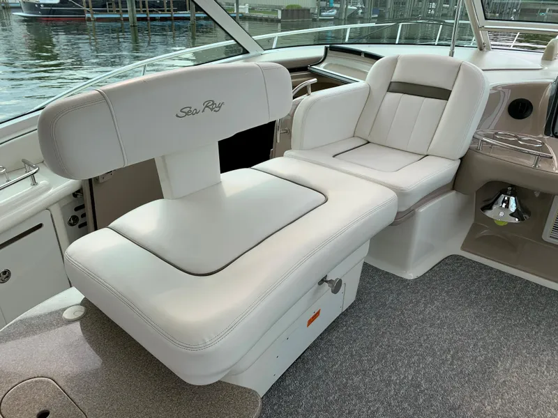 Slide: The Image of Interior of a 2007 Sea Ray 52 Sundancer with white leather seating. - 37