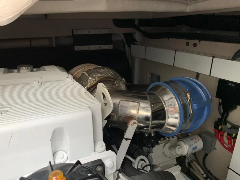 Slide: The Image of Engine room of 2007 Sea Ray 52 Sundancer, showing engine and exhaust. - 46