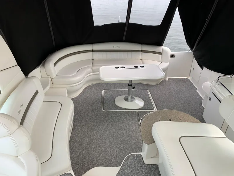 Slide: The Image of Interior of a 2007 Sea Ray 52 Sundancer yacht with white leather seating. - 6
