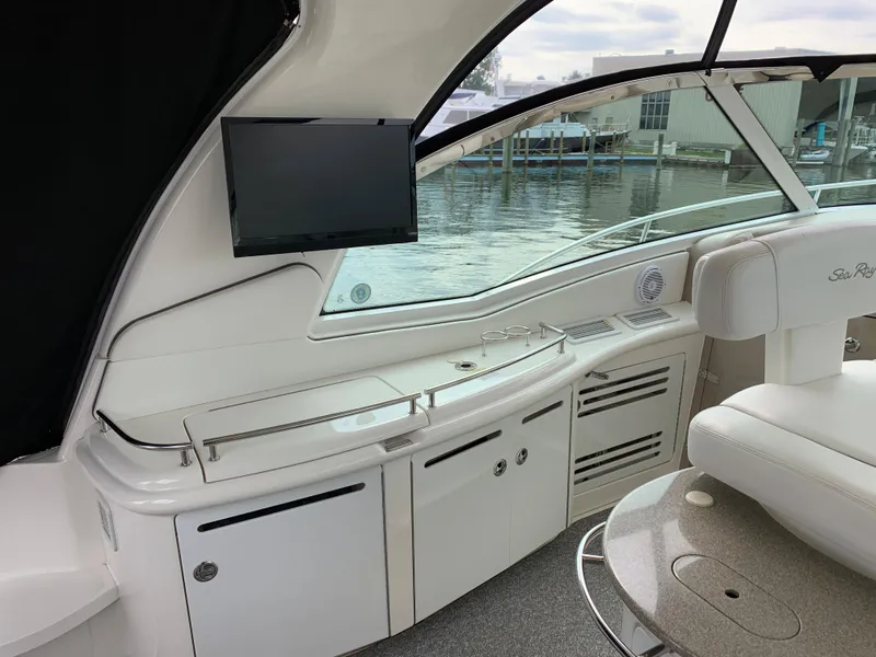Slide: The Image of Interior of a 2007 Sea Ray 52 Sundancer yacht with TV and harbor view. - 7