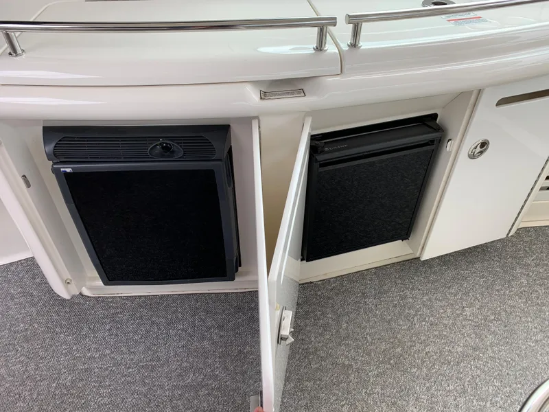 Slide: The Image of 2007 Sea Ray 52 Sundancer kitchen area with refrigerators. - 8