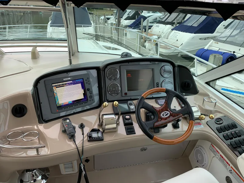 Slide: The Image of 2007 Sea Ray 52 Sundancer helm with navigation system. - 9