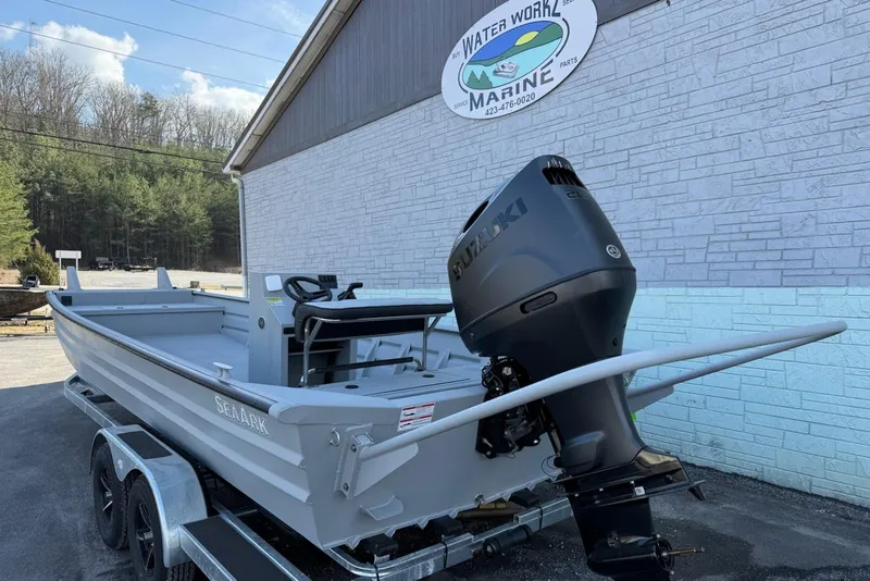 Slide: The Image of 2026 SeaArk 2472 Workhorse boat with Suzuki outboard motor on trailer. - 3