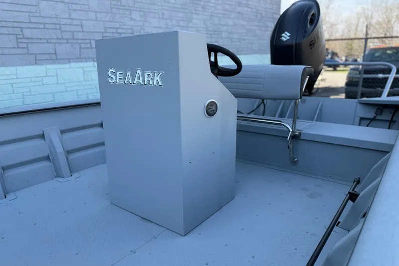 Slide: The Image of 2026 SeaArk 2472 Workhorse boat interior with steering console and seating. - 6