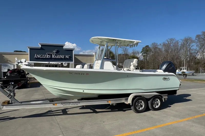 The Image of 2023 Sea Hunt Ultra 234 boat on trailer at Anglers Marine NC dealership. - 0