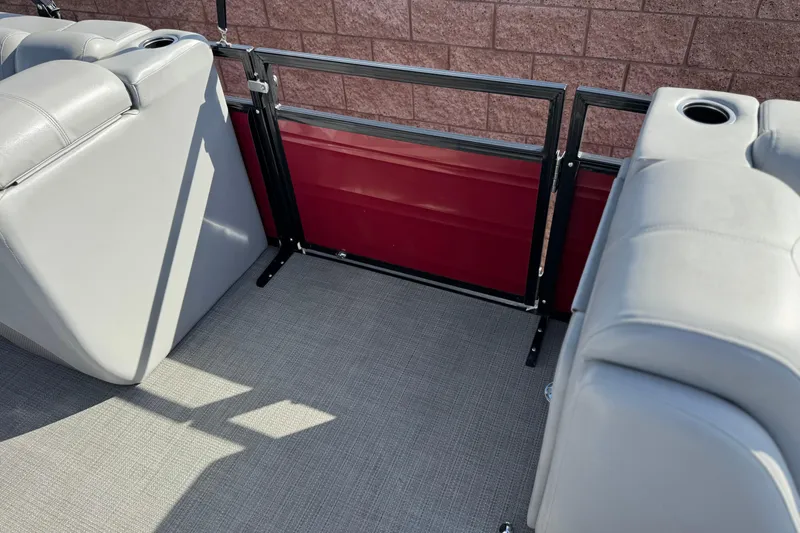 Slide: The Image of 2023 Regency 250 DL3 boat interior with gray seating and cup holders. - 15