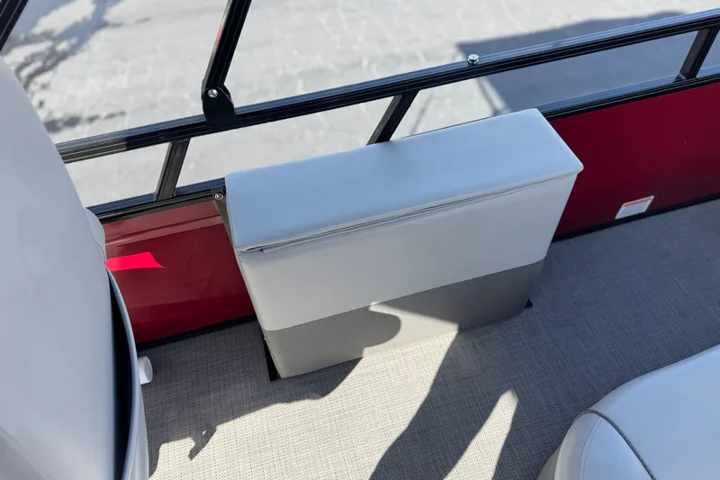 Slide: The Image of 2023 Regency 250 DL3 boat interior with red panel and cushioned seating. - 20