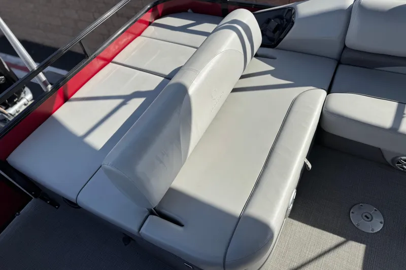 Slide: The Image of 2023 Regency 250 DL3 boat interior with gray seating and red accents. - 22