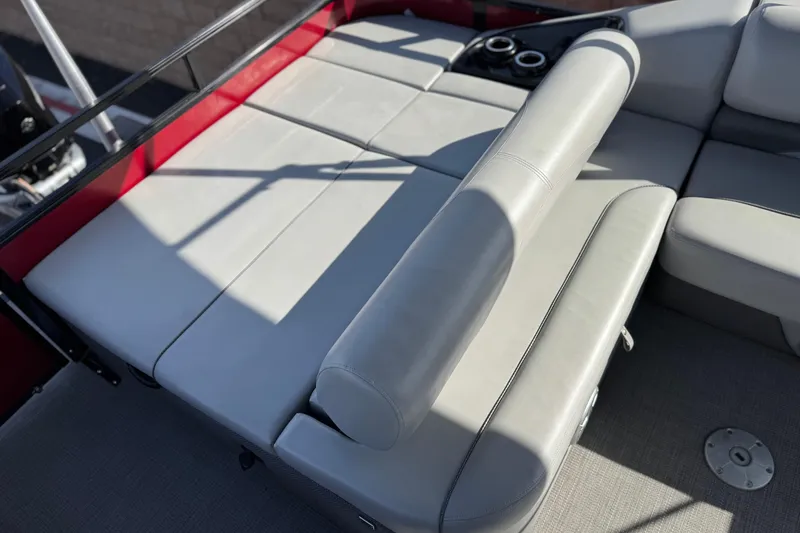 Slide: The Image of 2023 Regency 250 DL3 boat interior with gray seating and cup holders. - 23