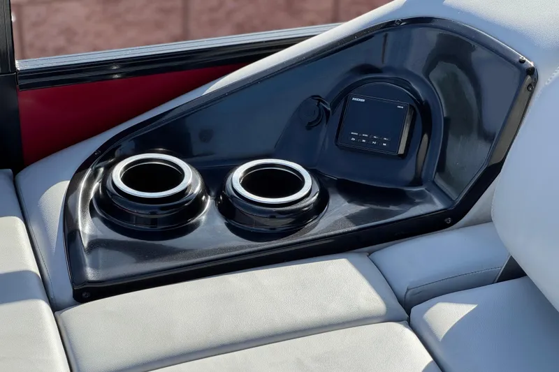 Slide: The Image of 2023 Regency 250 DL3 boat interior with cup holders and control panel. - 25