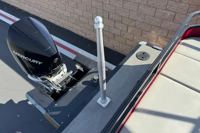 Slide: The Image of 2023 Regency 250 DL3 boat with Mercury engine, rear deck view. - 26