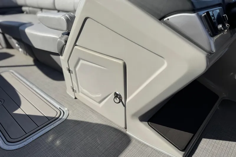 Slide: The Image of 2023 Regency 250 DL3 boat interior with storage compartment and seating. - 31
