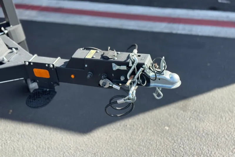 Slide: The Image of Trailer hitch of 2023 Regency 250 DL3 on asphalt surface. - 34